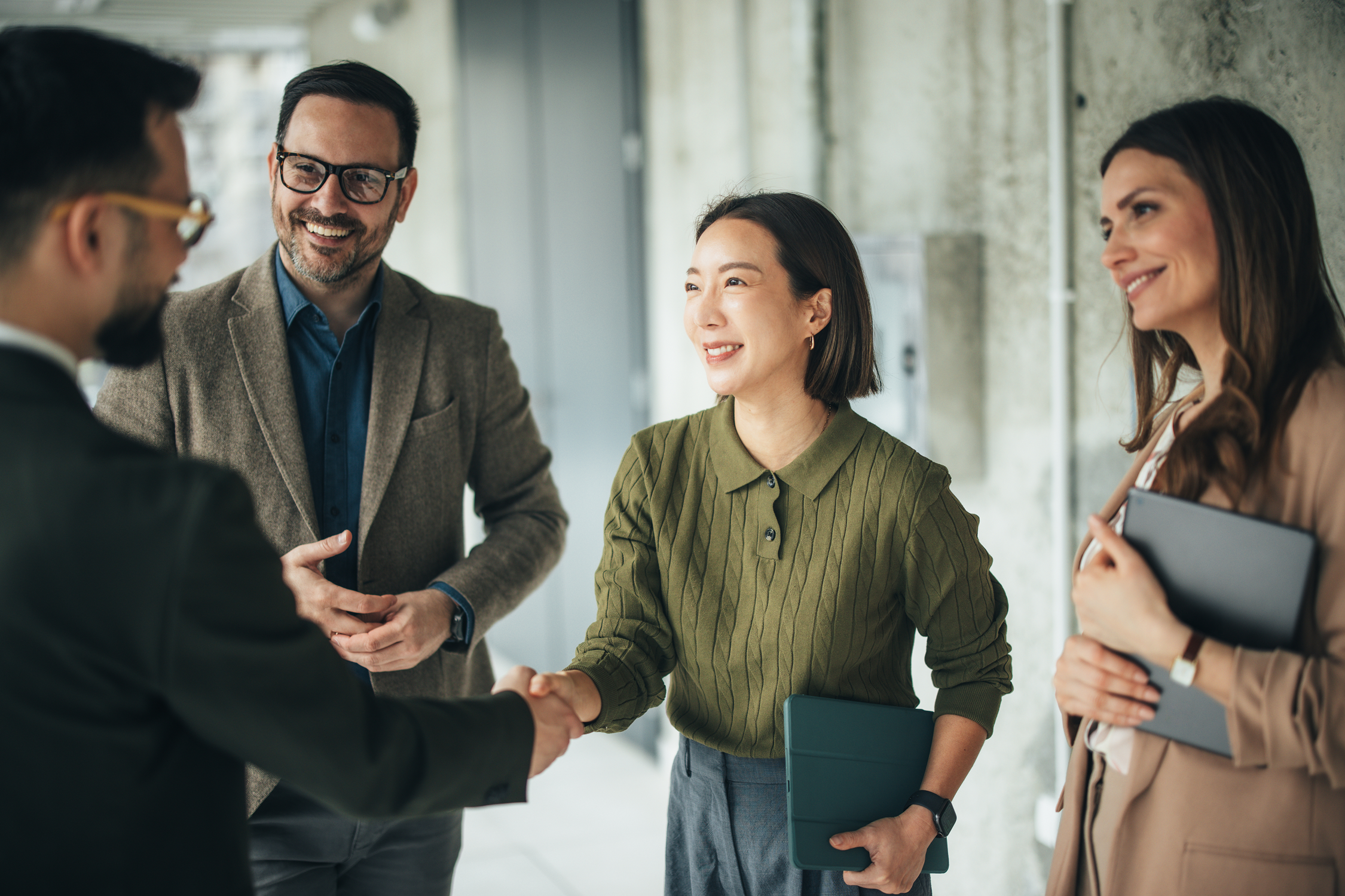 Business colleagues smiling and shaking hands